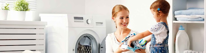 Mother and daughter doing laundry