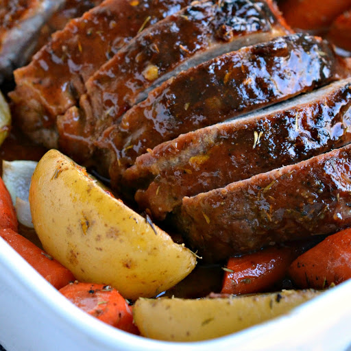 A flavorful Pork Loin roast glazed with a delicious honey mustard garlic sauce. It is roasted with potatoes, carrots and onions to complete an elegant yet easy meal.