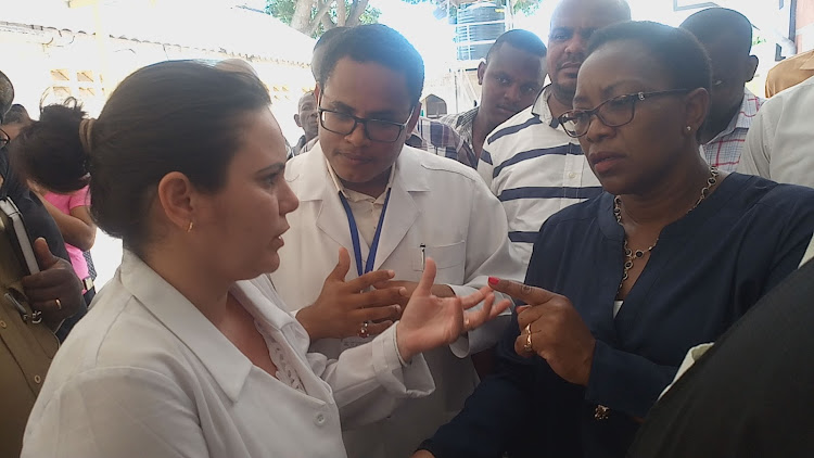 The Cuban doctors converses with Health CS Sicily Kariuki shortly after the CS opened the Renal Unit and CT-Scan at the King Fahad County Hospital in Lamu Town on November 16, 2018.