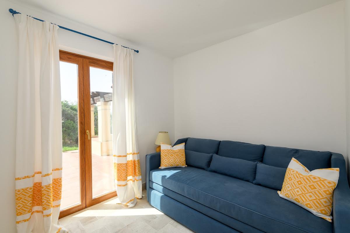 La Scogliera room interior deep blue sofa