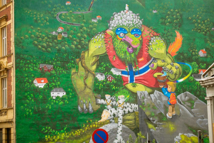 Wall art of a troll at an intersection in downtown Bergen, Norway. 