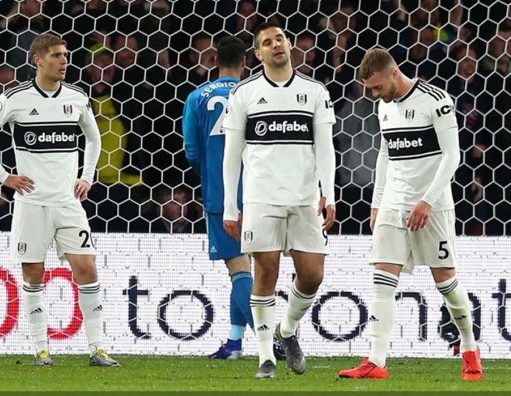 Fulham players look dejected after a 4-1 thrashing at Watford that left them relegated from the Premier League.