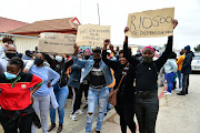 Teacher assistants, who claim they have not been paid since December, picket outside the education department offices in Port Elizabeth on Monday