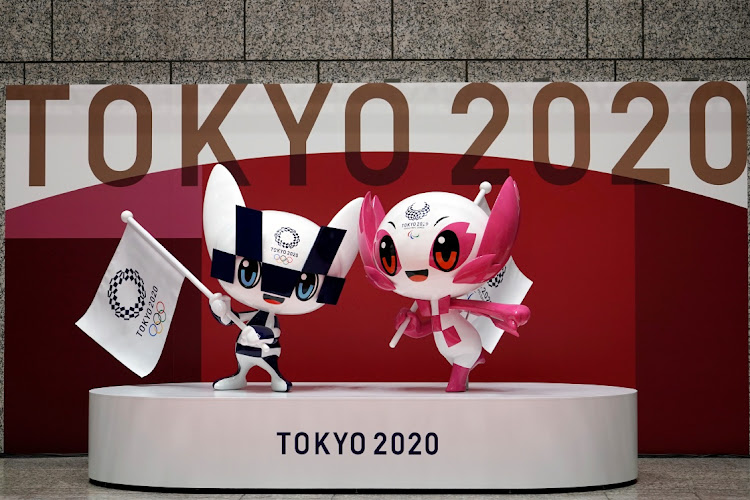 The statues of Miraitowa, left, and Someity, the official mascots for the Tokyo 2020 Olympics and Paralympics, at an unveiling event marking 100 days before the start of the Olympic Games, at the Tokyo Metropolitan Government building, in Tokyo on April 14, 2021