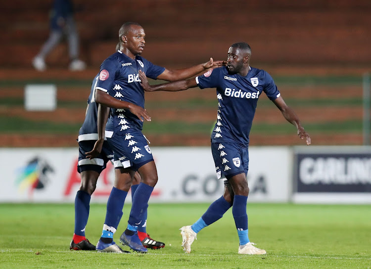 Bidvest Wits' strikers Deon Hotto (R) and Gift Motupa (L) celebrate a goal during a 3-1 Absa Premiership win at home against Black Leopards at Bidvest Stadium in Johannesburg on April 24 2019.