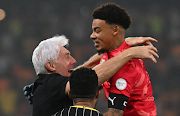 Bafana Bafana goalkepeer and captain Ronwen Williams celebrates with coach Hugo Broos after their penalties Africa Cup of Nations quarterfinal win against Cape Verde at Stade Charles Konan in Yamoussoukro, Ivory Coast on February 3.