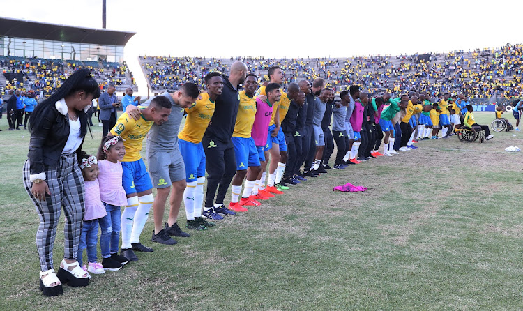 Mamelodi Sundowns players celebrate with the fans, family and relatives and the coaching stuff after a 5-0 Caf Champions League first leg quarterfinal win over Al Ahly in Pretoria on April 6 2019.