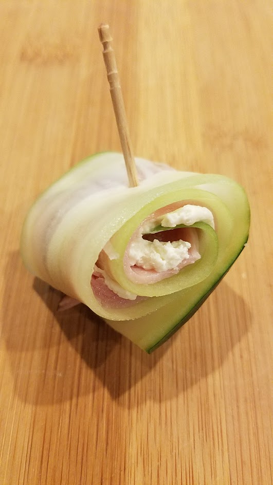 Slice cucumbers the long way to make cucumber roll ups for a healthy, vegetarian, gluten free bunch of bites for a party