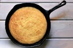 Southern Iron Skillet Cornbread was pinched from <a href="http://www.dishinanddishes.com/southern-iron-skillet-cornbread/" target="_blank">www.dishinanddishes.com.</a>