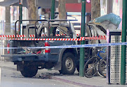 A burnt out vehicle is surrounded by police tape on Bourke Street in central Melbourne, Australia, after a terror attack on November 9 2018. 