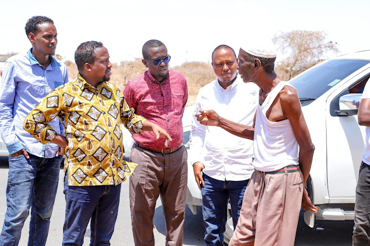 Garissa Deputy Governor Abdi Dagane with county and Gawasco officials in Bula Tawakal during a fact-finding mission on two major water projects in Garissa town.
