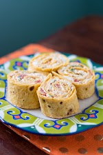 Chicken Enchilada Pinwheels was pinched from <a href="http://cooklikeachampion.com/2014/01/chicken-enchilada-pinwheels/" target="_blank">cooklikeachampion.com.</a>