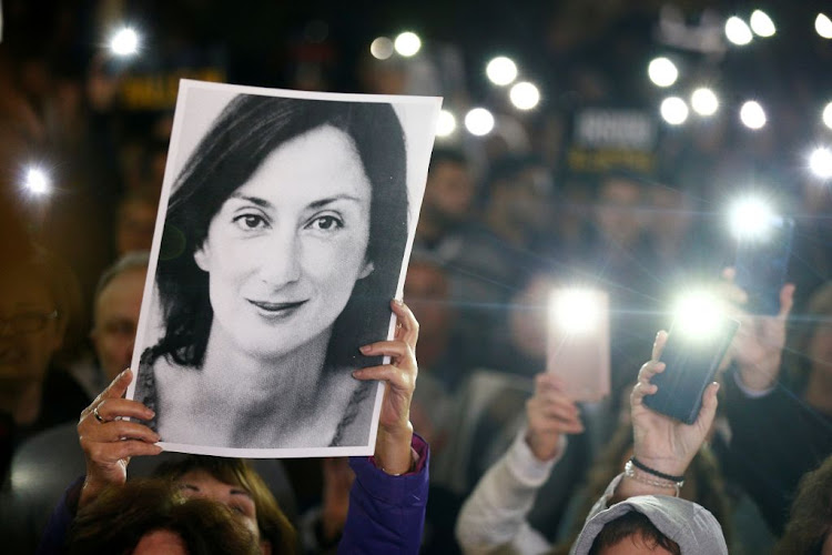 People gather at the Great Siege Square calling for the resignation of Joseph Muscat following the arrest of one of the country's most prominent businessmen as part of the investigation into the murder of journalist Daphne Caruana Galizia, in Valletta, Malta, on November 20 2019.