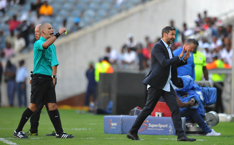 Orlando Pirates coach Josef Zinnbauer is booked by referee Victor Gomes during the Nedbank Cup Last 32 match against Bidvest Wits at Orlando Stadium in Soweto on February 9 2020.