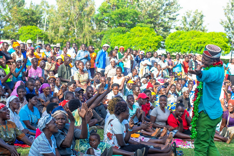 Shofco CEO and founder Kennedy Odede interacting with Siaya residents.