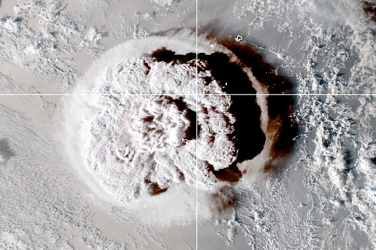 The eruption of an underwater volcano off Tonga, which triggered a tsunami warning for several South Pacific island nations, is seen in an image from the NOAA GOES-West satellite taken at 05:00 GMT on January 15 2022.