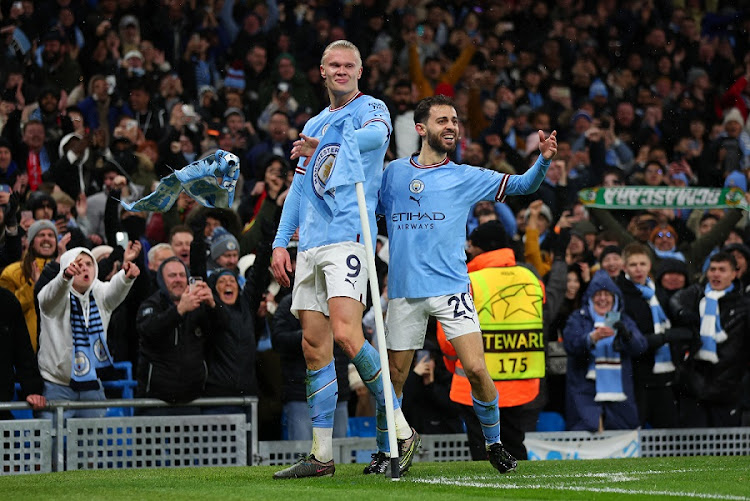 Erling Haaland of Manchester City celebrates scoring his second goal with Bernardo Silva in the Uefa Champions League last 16 secod leg match against RB Leipzig at Etihad Stadium in Manchester on March 14 2023.