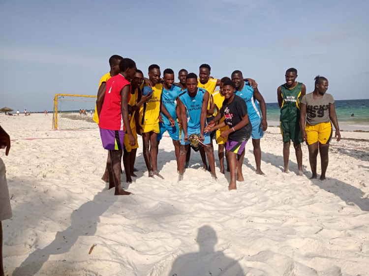 Pwani University celebrate at the conclusion of the 2021/22 Beach Handball League