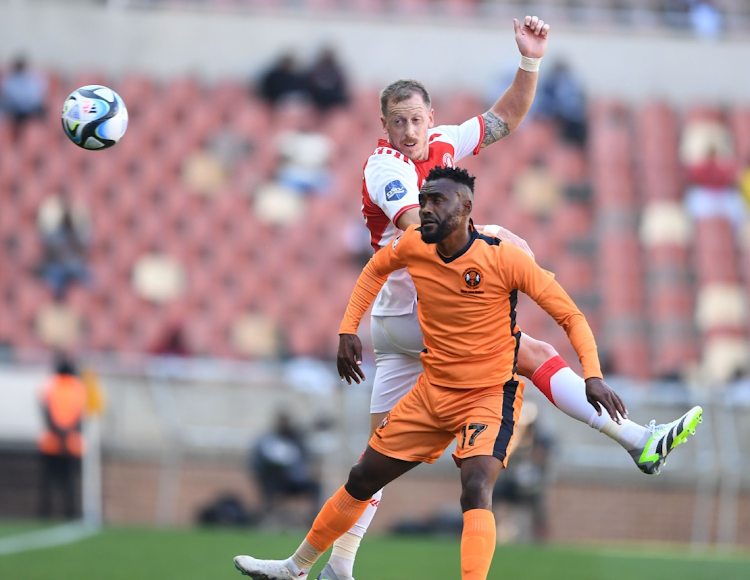 Given Mashikinya of Polokwane City and Michael Morton of Cape Town Spurs during the DStv Premiership match between Polokwane City and Cape Town Spurs at Peter Mokaba Stadium on Saturday