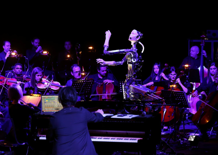 MUSIC BY NUMBERS: A robot maestro leads an orchestra at the Sharjah Performing Arts Academy in Sharjah in the United Arab Emirates