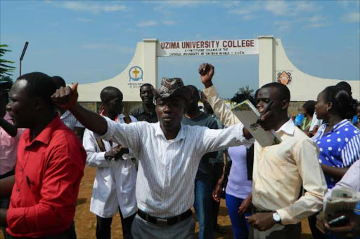 Some students of Uzima University College students protest outside the institution in Kisumu.