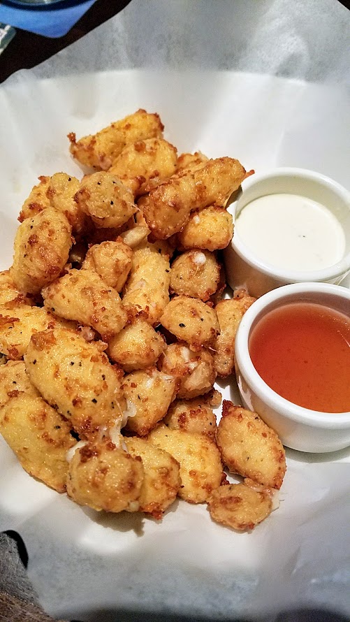 Yard House Portland Wisconsin Fried Cheese Curds (Vegetarian) with a buttermilk batter, honey hot sauce, horseradish aïoli.