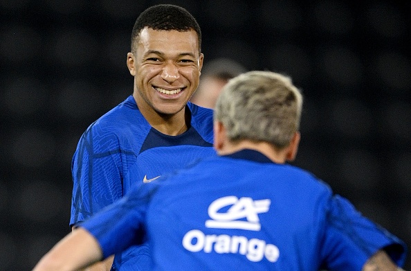 France's forward #10 Kylian Mbappe smiles during training session at the Al Sadd SC training center in Doha, on December 8, 2022, in the build-up to the Qatar 2022 World Cup quarter final football match between France and England.