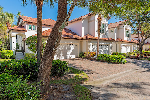 Buy this luxury apartment / penthouse in Naples (United States) - House facade with garages and garden