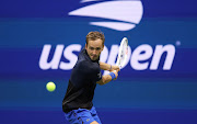 Daniil Medvedev of Russia returns a shot against Arthur Rinderknech of France in their second round match at the 2022 US Open.