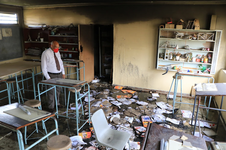 Bethelsdorp Comprehensive School principal Ralph Jacobus assesses the damage caused after a classroom was set alight.