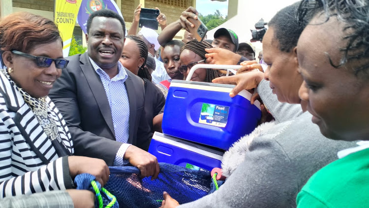 Tharaka Nithi Governor Muthomi Njuki when he donated freezers to farmers in Mitheru Tharaka Nithi County