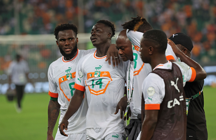 Franck Kessie and Oumar Diakite of Cote dIvoire react in disappointment during the 2023 Africa Cup of Nations match against Equatorial Guinea at Alassane Ouattara Stadium in Abidjan, Cote dIvoire on 22 January 2024.