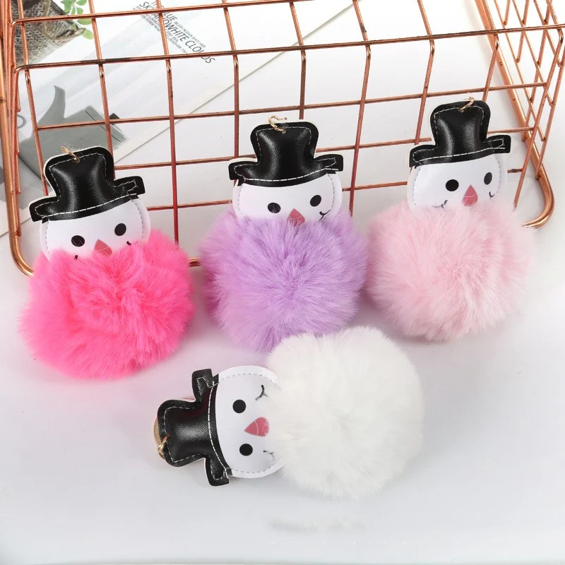 Adorable Snowman Fur Ball Keychain Pendant, a cute and cuddly accessory for your keys or bag, perfect for adding winter 