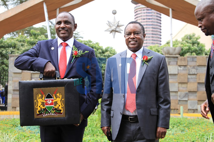 Treasury CS Ukur Yattani with Treasury PS Julius Muia ahead of the Budget reading in Parliament on June 10, 2021