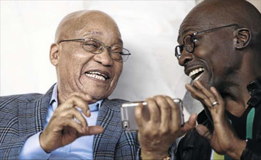 President Jacob Zuma and Home Affairs Minister Malusi Gigaba react while looking at a cellphone. The writer says social media can have both good and bad impacts on the society. Photo: Rogan Ward