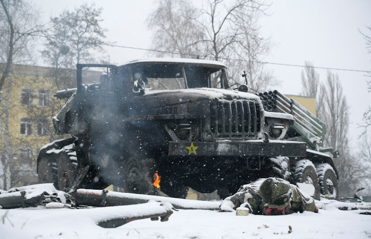 A soldier lies near a destroyed Russian army multiple rocket launcher in Kharkiv, Ukraine 0n February 28 2022. Picture: REUTERS/MAKSIM LEVIN