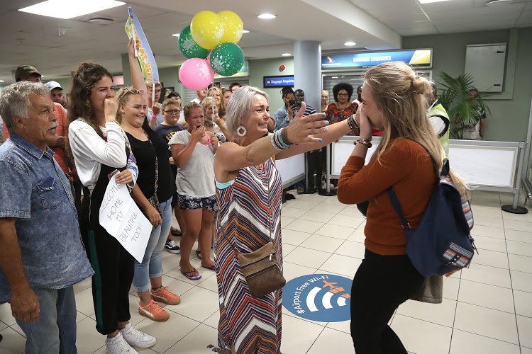 Tristan-Lee Niemand receives a warm welcome as she arrives home