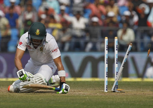 South Africa's Faf du Plessis sits after he was bowled out by India's Amit Mishra during the third day of their third test cricket match in Nagpur, India. Picture credits: Reuters