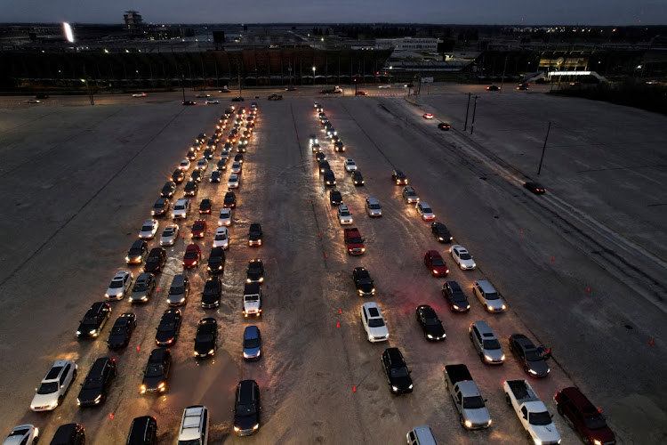 People wait in long lines at the Indianapolis Motor Speedway for coronavirus disease (Covid-19) testing and vaccines, as the Omicron variant continues to spread in Indianapolis, Indiana, US. December 29, 2021.