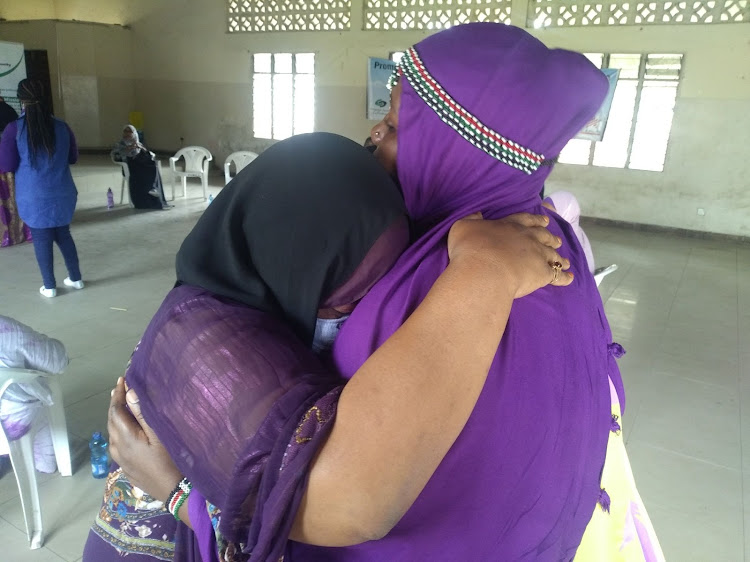 Zuwena Rukia (not her real name) hugs EJI founder Fatuma Juma at Frere Town Social Hall in Frere Town, Mombas, on Thursday, August 30.