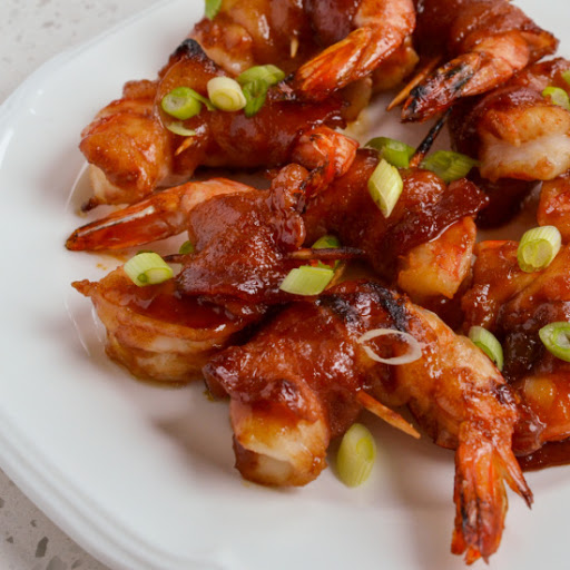 An easy to make appetizer recipe that is always a hit with family and friends. The slightly spicy sweet Asian sauce takes these Bacon Wrapped Shrimp off the charts.