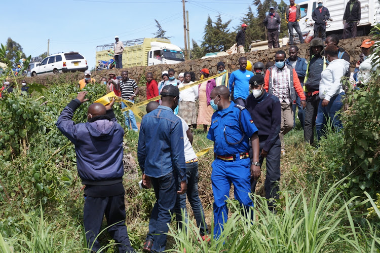 Police cordon off an area where a body of a 26-year-old man was found in Mutarakwa area, Limuru, on Friday.