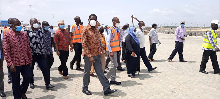 Agriculture and Livestock CS Peter Munya, PS Hillary Kimutai and other officials at the Lamu port on Saturday.