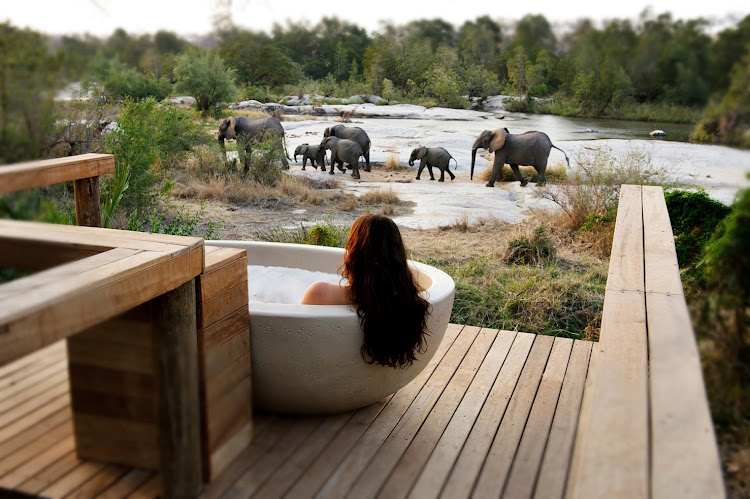 A riverview bath in one of Londolozi Game Reserve's Private Granite Suites.