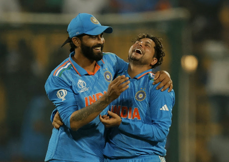 India's Kuldeep Yadav (right) celebrates with Ravindra Jadeja after taking the wicket of Netherlands' Logan van Beek in the ICC Cricket World Cup match against Netherlands at M Chinnaswamy Stadium in Bengaluru, India on Sunday.