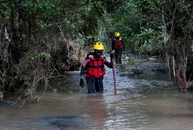 Rescuers search for bodies in Umbumbulu near Durban, South Africa, April 18, 2022.