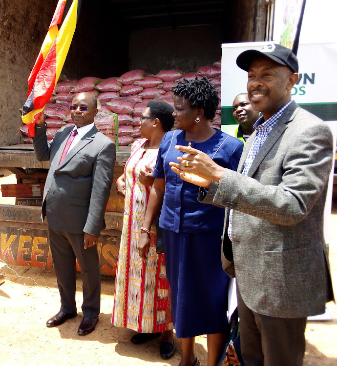 Ministers of state Agriculture, NAADs Executive Director and members of Parliament Dispatching seedlings to karamoja.