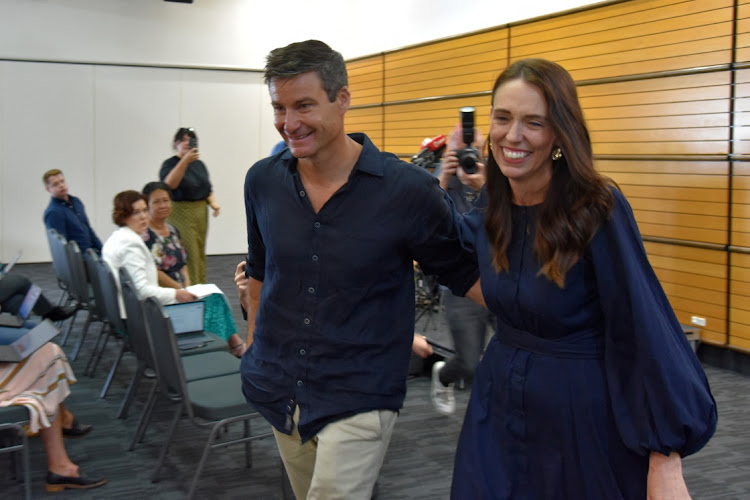 New Zealand Prime Minister Jacinda Ardern leaves with longtime partner Clarke Gayford following the announcement of her resignation at the War Memorial Hall, in Napier, New Zealand January 19 2023. Picture: REUTERS