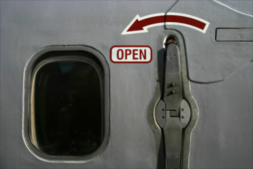 Airplane window, emergency exit. File photo