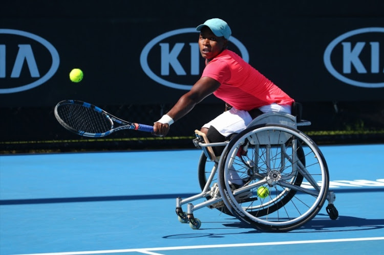 Kgothatso Montjane of South Africa plays a backhand in her first round match against Aniek Van Koot of the Netherlands in the Australian Open 2018 Wheelchair Championships at Melbourne Park on January 24, 2018 in Melbourne, Australia.